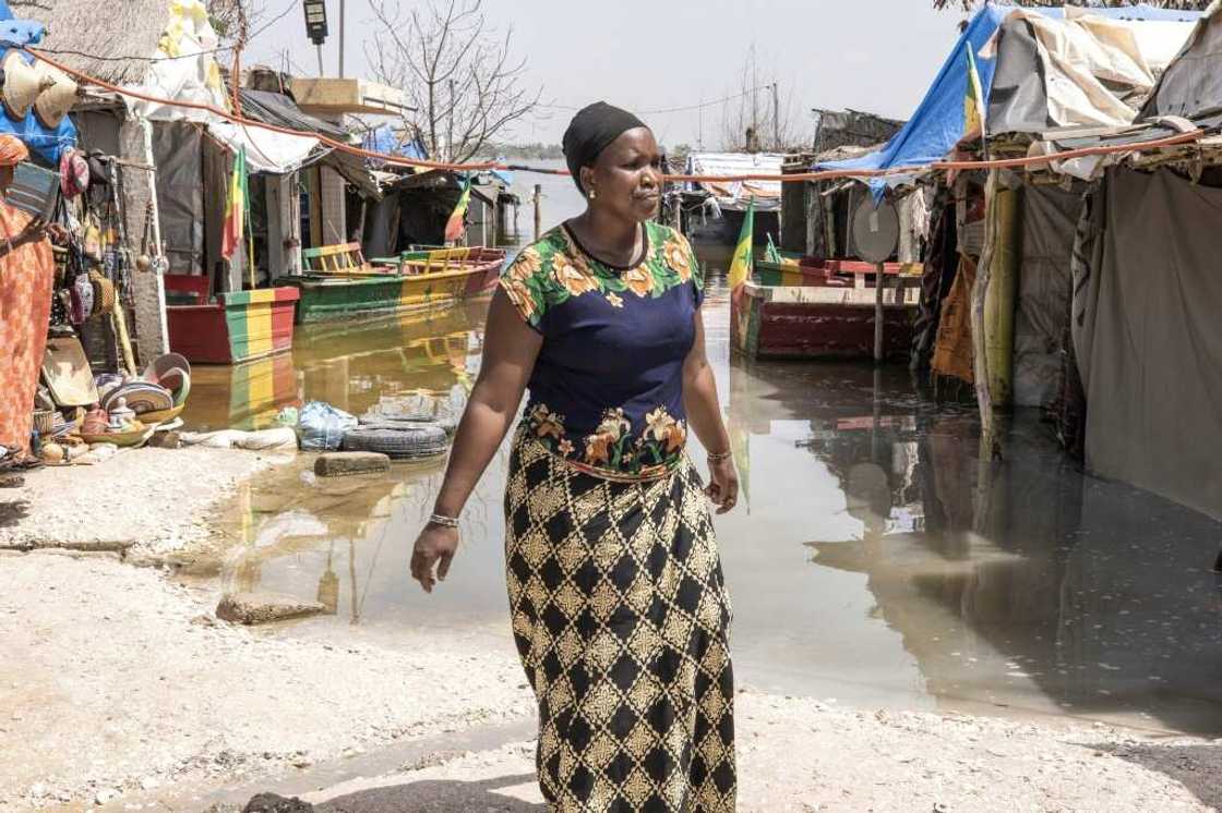 The lake is a magnet for tourists, drawn by the pink tinge caused by the salt The lake is a magnet for tourists, drawn by the pink tinge caused by the salt