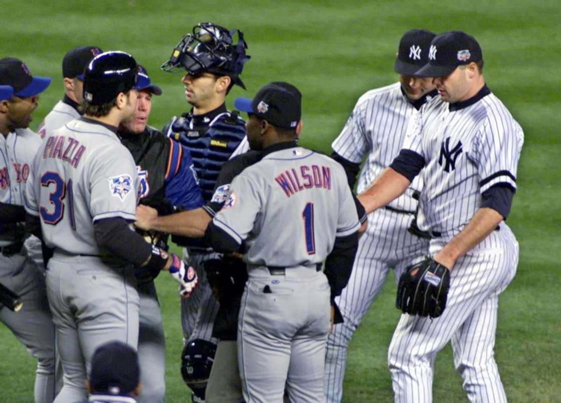New York Yankees and New York Mets players confront one another. New York Yankees and New York Mets players confront one another.