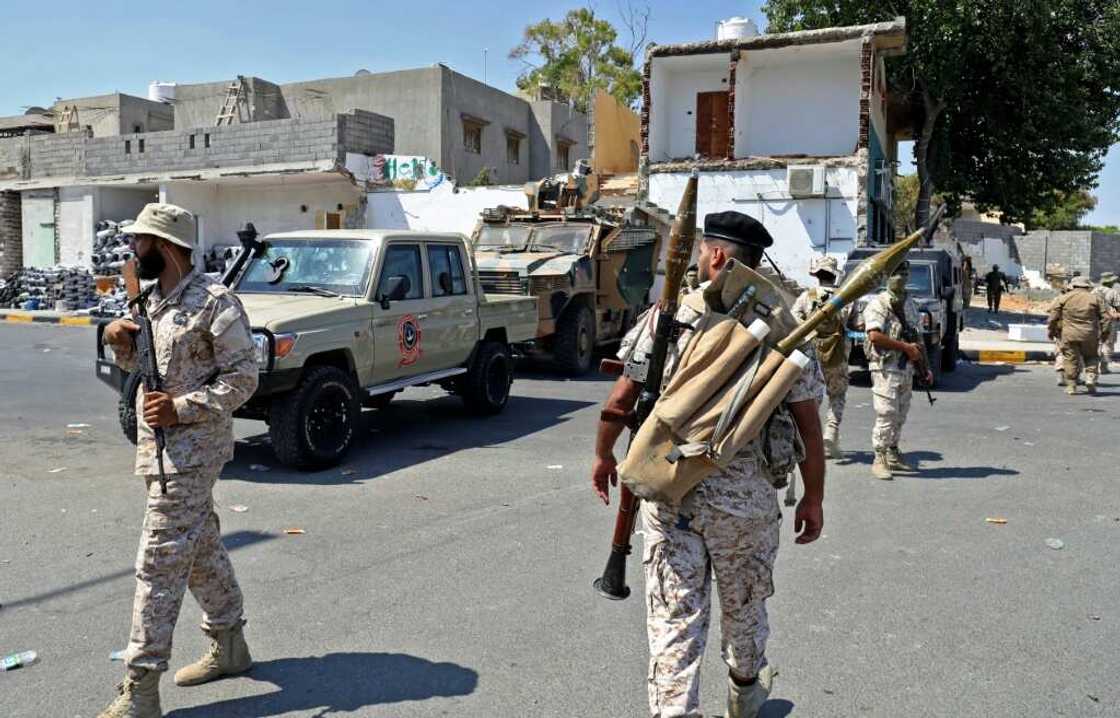 Members of the 444 Brigade affiliated with Libya's defence ministry man positions in the area of an overnight gunbattle in Tripoli's suburb of Ain Zara Members of the 444 Brigade affiliated with Libya's defence ministry man positions in the area of an overnight gunbattle in Tripoli's suburb of Ain Zara