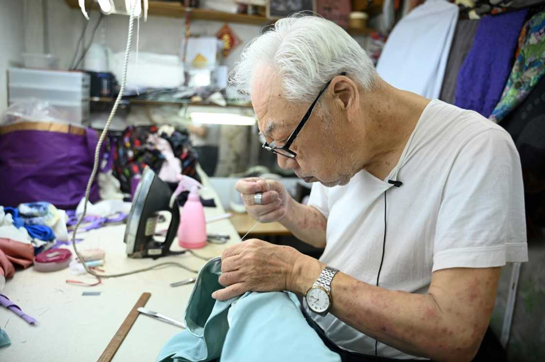 At 88, Yan Kar-man is one of Hong Kong's oldest master tailors of the cheongsam, an elegant, high-collared Chinese dress recognisable for its form-fitting silhouette