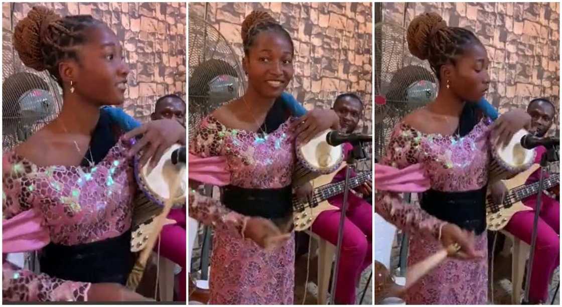 Photos of a Nigerian girl playing the Yoruba Talking Drum. Photos of a Nigerian girl playing the Yoruba Talking Drum.
