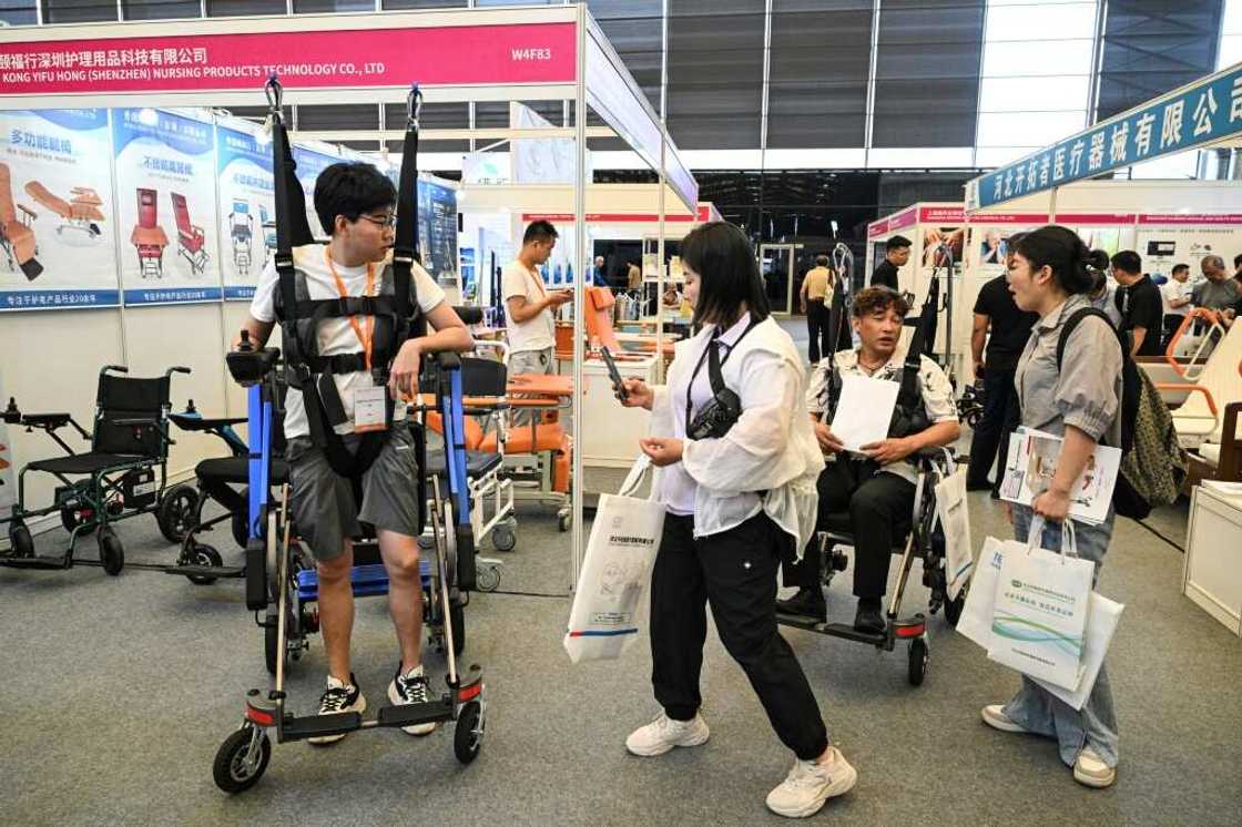 China's elder care industry is pushing products such as automated stair-climbing machines and devices designed to lift people from their beds into wheelchairs China's elder care industry is pushing products such as automated stair-climbing machines and devices designed to lift people from their beds into wheelchairs