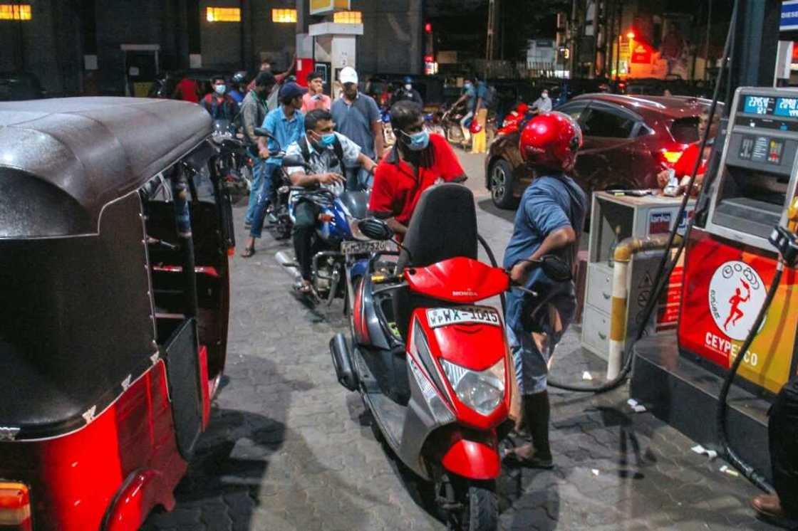 The country's fuel crisis has led to rationing orders by the government and long queues at the island's filling stations The country's fuel crisis has led to rationing orders by the government and long queues at the island's filling stations