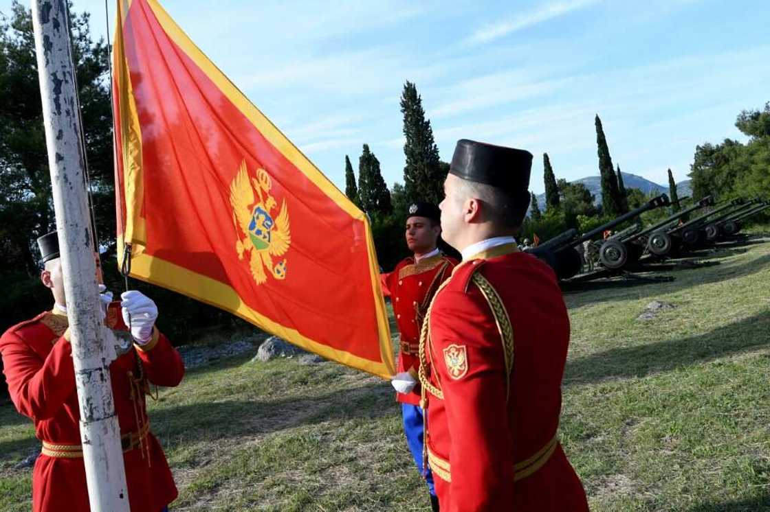 The shooting took place in Cetinje, some 36 kilometres (22 miles) west of Podgorica, the capital of Montenegro (flag pictured being raised by soldiers in May 2020) The shooting took place in Cetinje, some 36 kilometres (22 miles) west of Podgorica, the capital of Montenegro (flag pictured being raised by soldiers in May 2020)