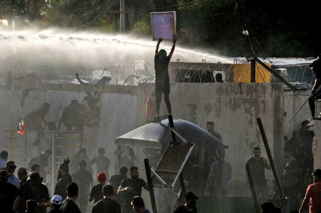 Iraqi security forces use a water cannon against supporters of the Coordination Framework to stop them entering the Green Zone on Monday Iraqi security forces use a water cannon against supporters of the Coordination Framework to stop them entering the Green Zone on Monday