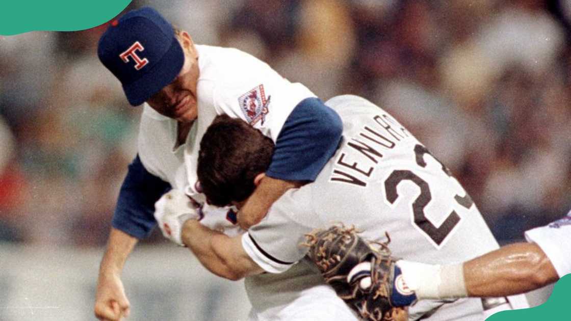 Nolan Ryan and Robin fight during a game between the Texas Rangers and the Chicago White Sox. Nolan Ryan and Robin fight during a game between the Texas Rangers and the Chicago White Sox.