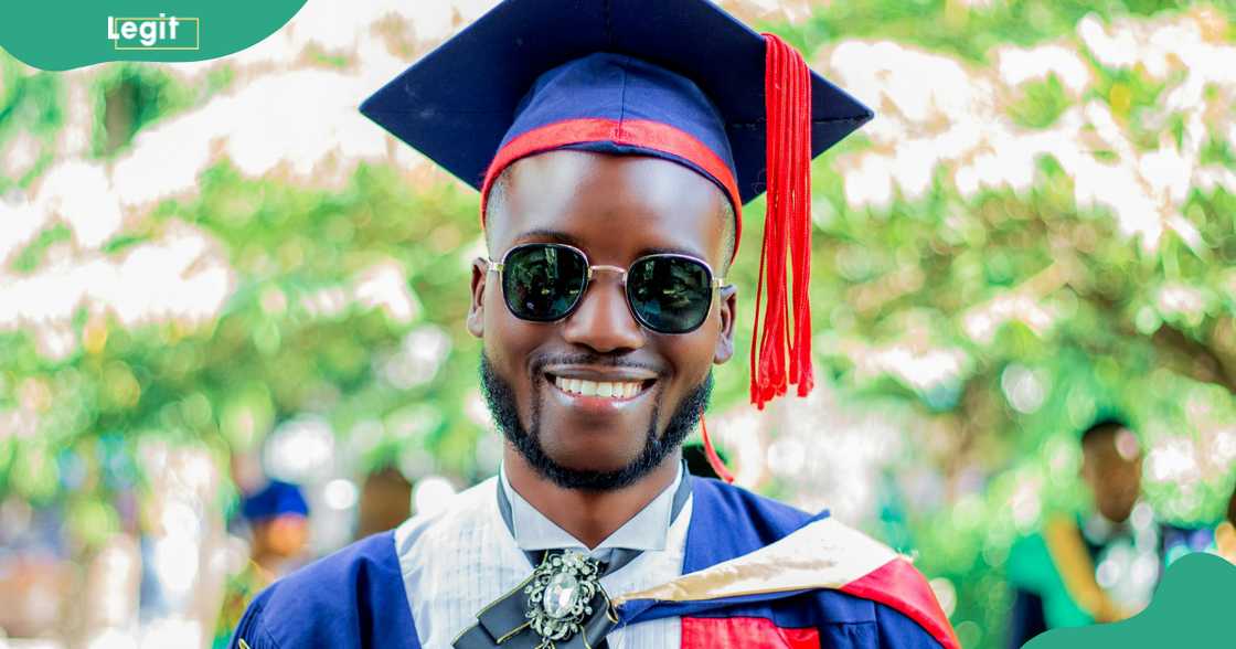 Male university student in a blue graduation gown and cap.