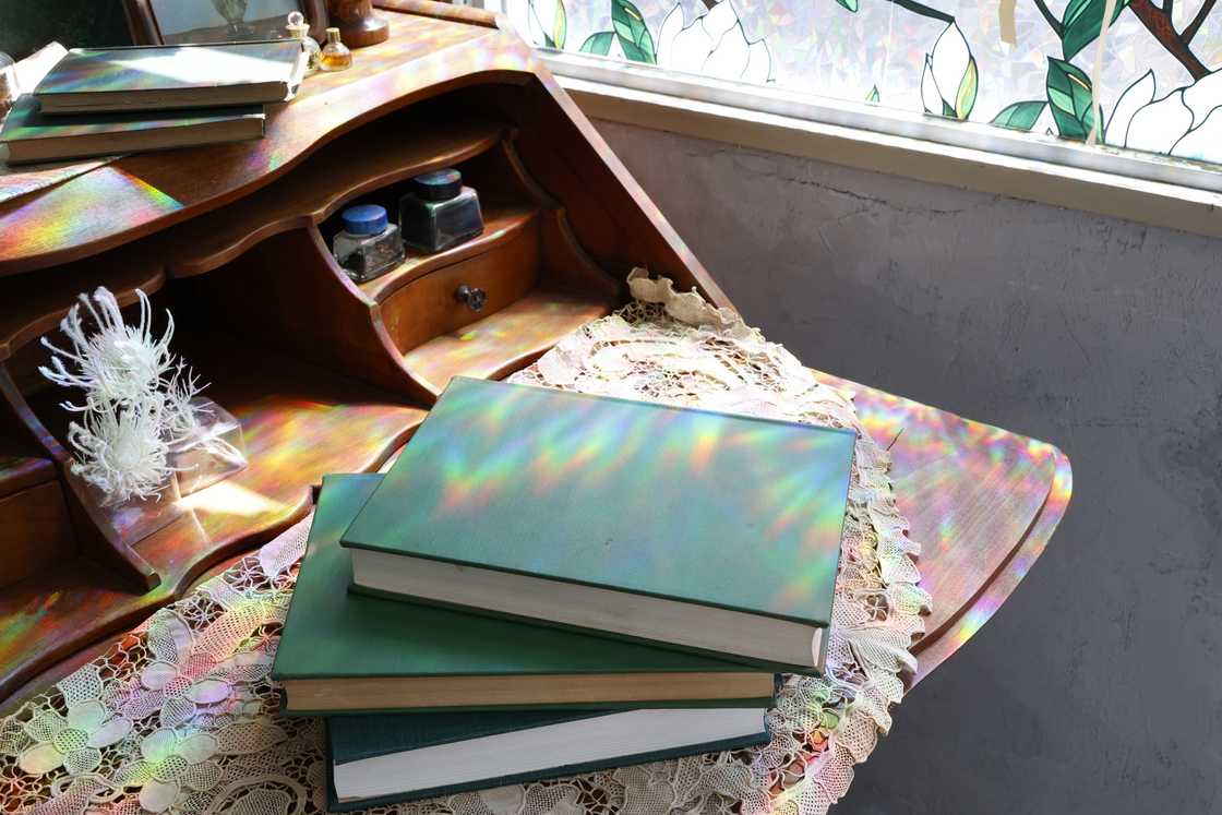 Books displayed on a small bedside table. Books displayed on a small bedside table.
