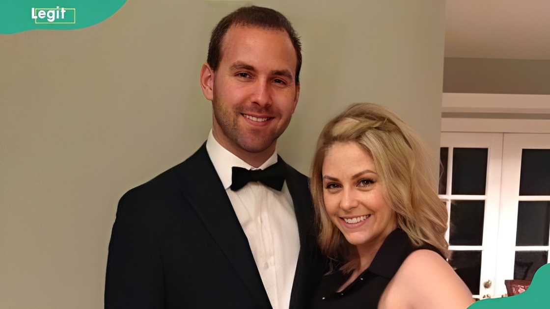 Emily Hart and her husband pose for a photo Emily Hart and her husband pose for a photo