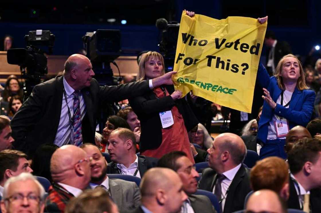 Truss's speech was interrupted by protesters from Greenpeace UK Truss's speech was interrupted by protesters from Greenpeace UK