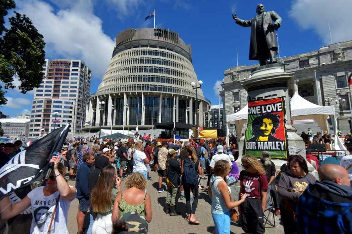Anti-vaccine demonstrators occupy the grounds surrounding the parliament building in Wellington, New Zealand, on February 22, 2022 Anti-vaccine demonstrators occupy the grounds surrounding the parliament building in Wellington, New Zealand, on February 22, 2022