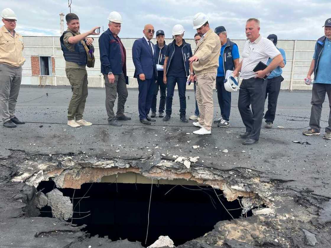 Members of the IAEA team inspected the damage caused by shelling during a recent visit to the plant Members of the IAEA team inspected the damage caused by shelling during a recent visit to the plant