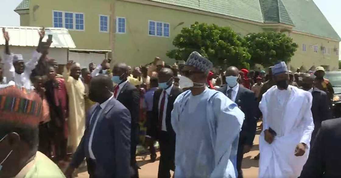 Buhari trekking home from Eid prayer ground Buhari trekking home from Eid prayer ground