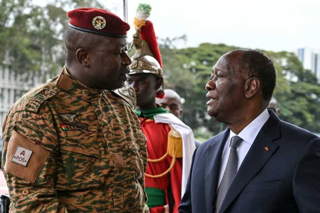 Junta chief Damiba (L) has pledged to restore civilian rule within two years and to put down the armed insurgency Junta chief Damiba (L) has pledged to restore civilian rule within two years and to put down the armed insurgency