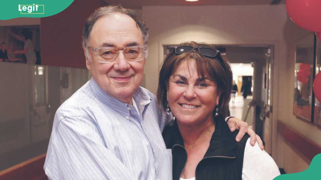Barry and Honey Sherman embracing each other in an indoor setting Barry and Honey Sherman embracing each other in an indoor setting