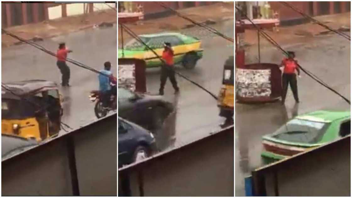 Heartwarming Moment Female Officer Controls Traffic under Heavy Rain in Kwara state, her Video Goes Viral Heartwarming Moment Female Officer Controls Traffic under Heavy Rain in Kwara state, her Video Goes Viral