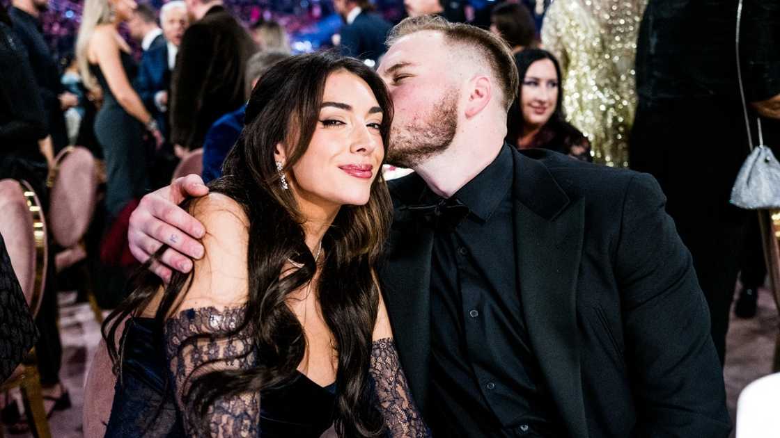 Zach Bryan kisses Brianna LaPaglia during the 66th Grammy Awards. Zach Bryan kisses Brianna LaPaglia during the 66th Grammy Awards.