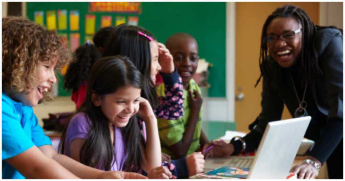 UK class, African lady, laughing at teacher's dad UK class, African lady, laughing at teacher's dad
