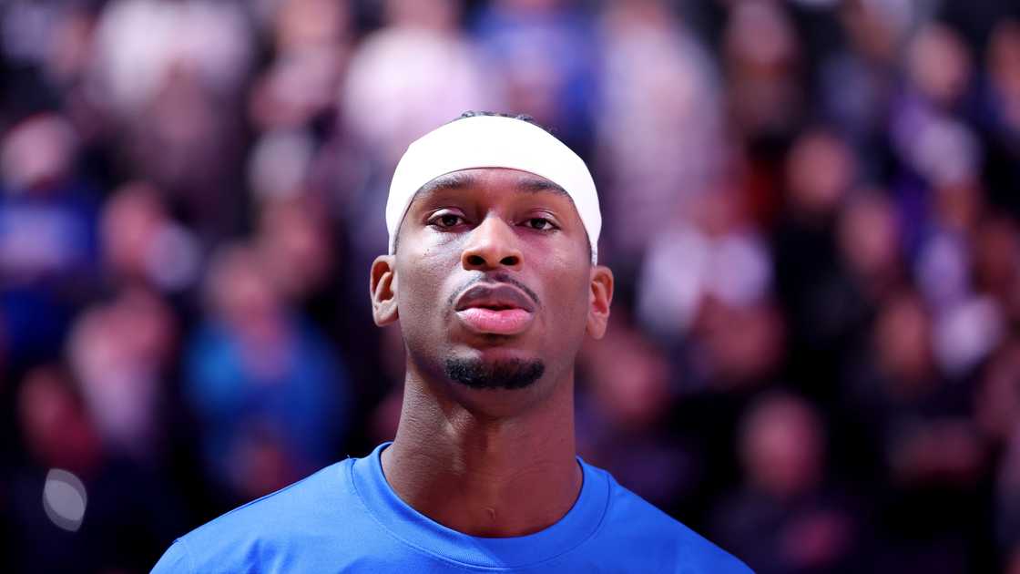 Shai Gilgeous-Alexander of the Oklahoma City Thunder stands for the national anthem before a 2023 game Shai Gilgeous-Alexander of the Oklahoma City Thunder stands for the national anthem before a 2023 game