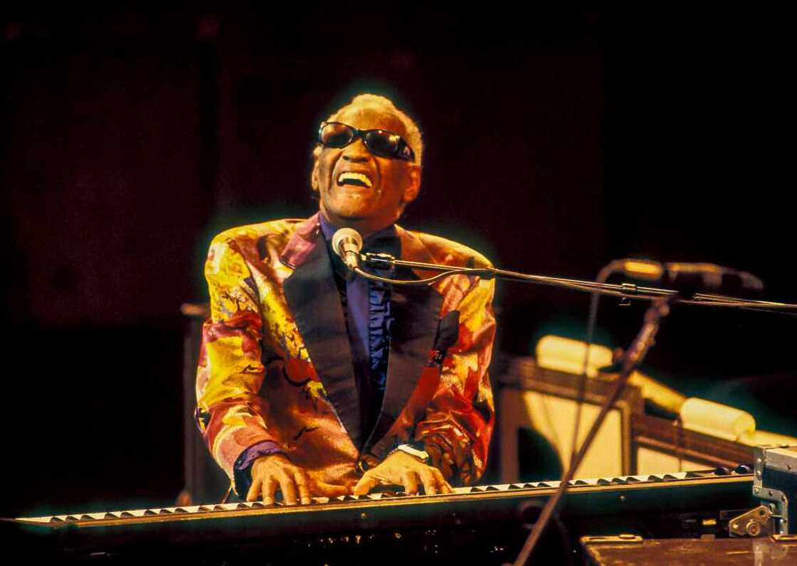 American R&B and Soul musician Ray Charles plays the piano while performing American R&B and Soul musician Ray Charles plays the piano while performing