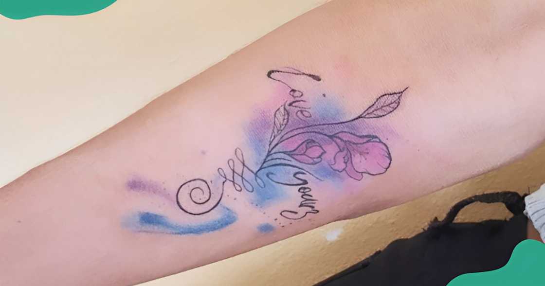 A watercolour Love Yourz tattoo design on the arm. A watercolour Love Yourz tattoo design on the arm.