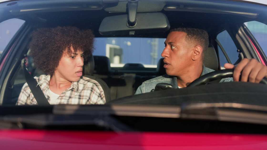 A woman shouting at man, sitting in automobile A woman shouting at man, sitting in automobile