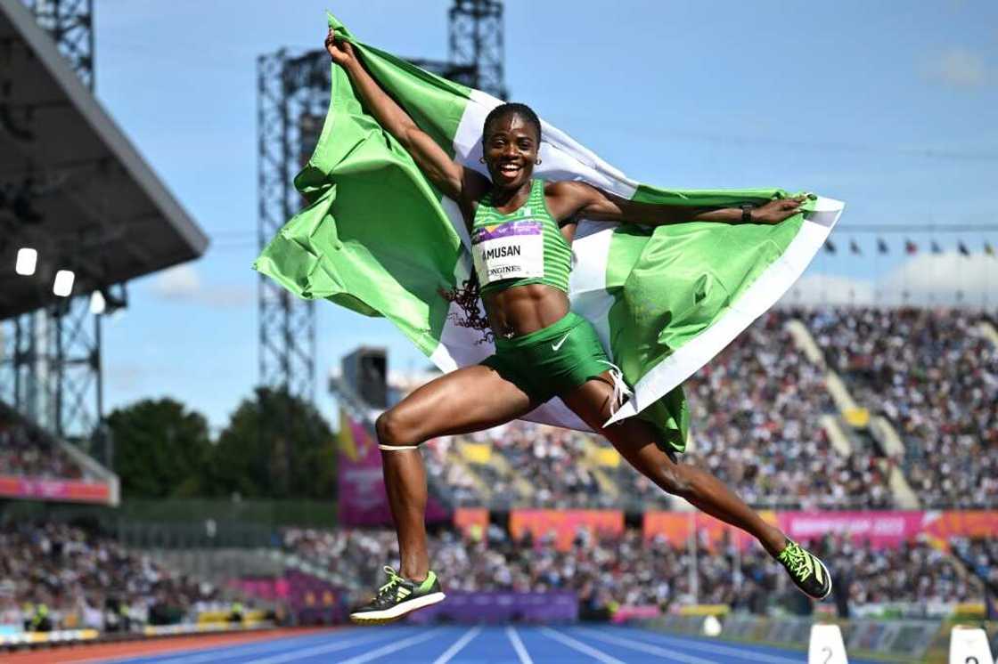 Nigeria's Tobi Amusan celebrates her gold medal in the women's 100m hurdles Nigeria's Tobi Amusan celebrates her gold medal in the women's 100m hurdles