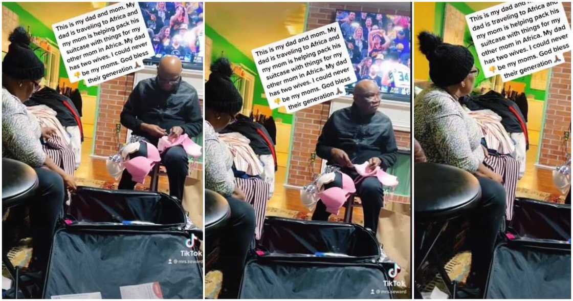 Second wife based in Nigeria, husband, wife, helps husband pack items Second wife based in Nigeria, husband, wife, helps husband pack items