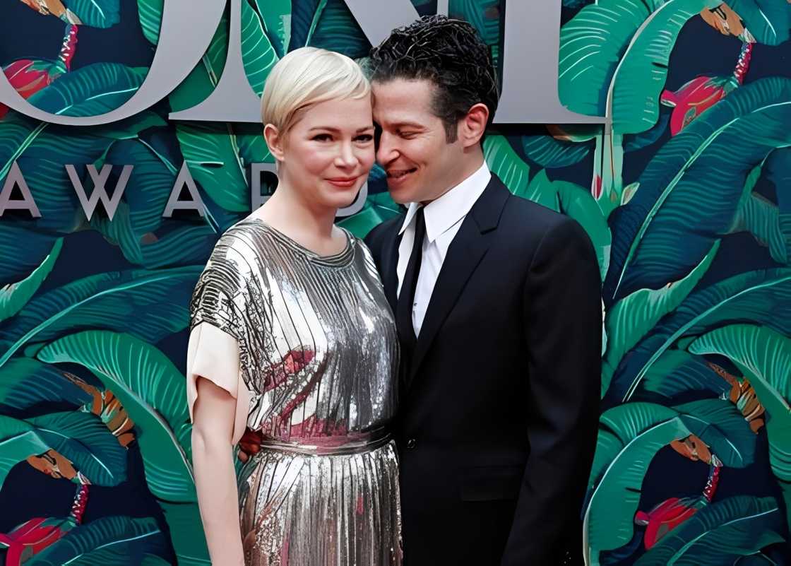 Michelle Williams and Thomas Kail pose on the red carpet of the Tony Awards Michelle Williams and Thomas Kail pose on the red carpet of the Tony Awards