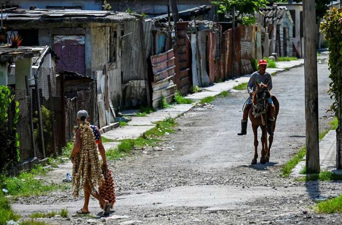 A street in the neighborhood of La Guinera on the outskirts of Havana is seen in June 2022 A street in the neighborhood of La Guinera on the outskirts of Havana is seen in June 2022
