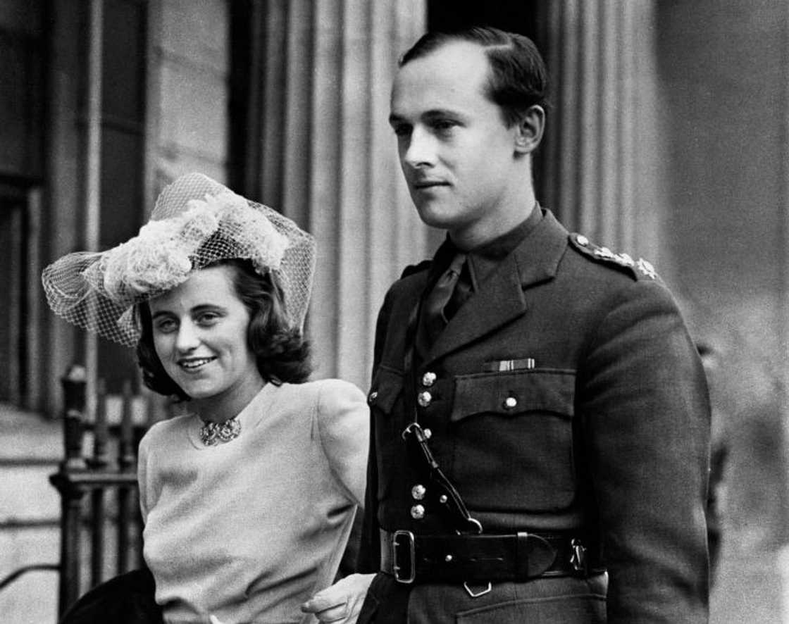 A black and white photo of Kathleen Kennedy (L) holding her husband William Cavendish, Marquess of Hartington (R)