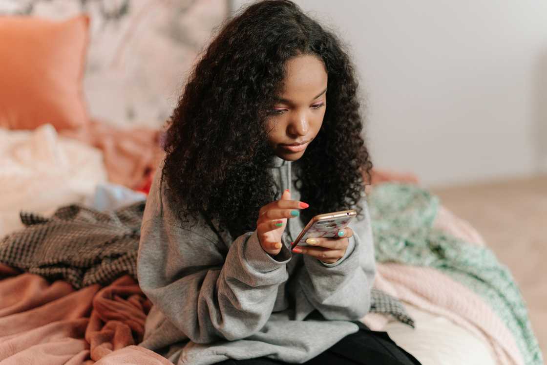 A young lady using her mobile phone