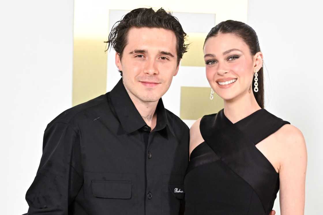 Brooklyn Beckham and Nicola Peltz in all black attend the Paris Fashion Week