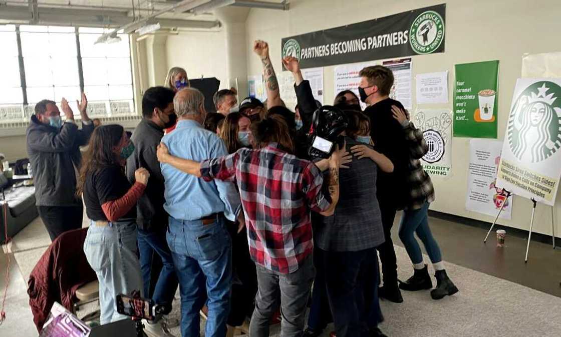 Workers at a Buffalo Starbucks celebrate in December 2021 after they established the chain's first union at a US store Workers at a Buffalo Starbucks celebrate in December 2021 after they established the chain's first union at a US store