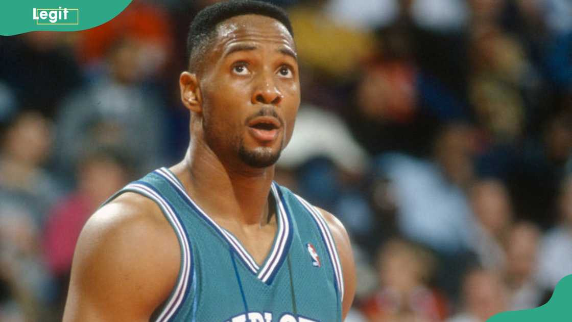 Alonzo Mourning looks on against the Washington Bullets during an NBA basketball game Alonzo Mourning looks on against the Washington Bullets during an NBA basketball game