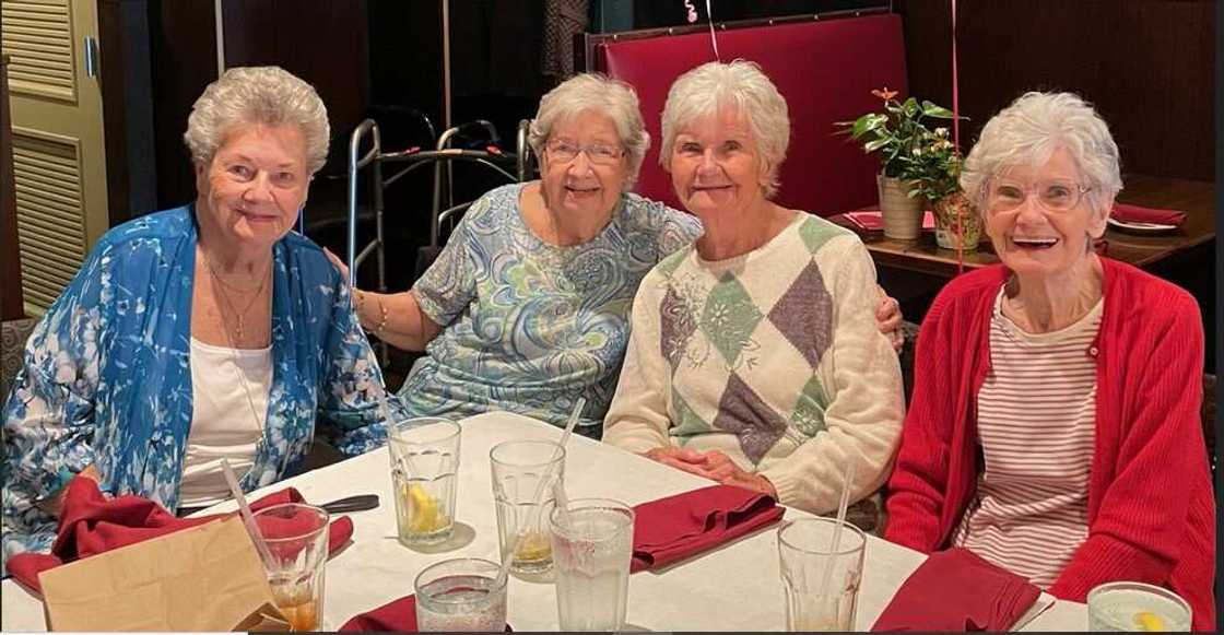 Family photo of 90-year-old twin sisters and their siblings