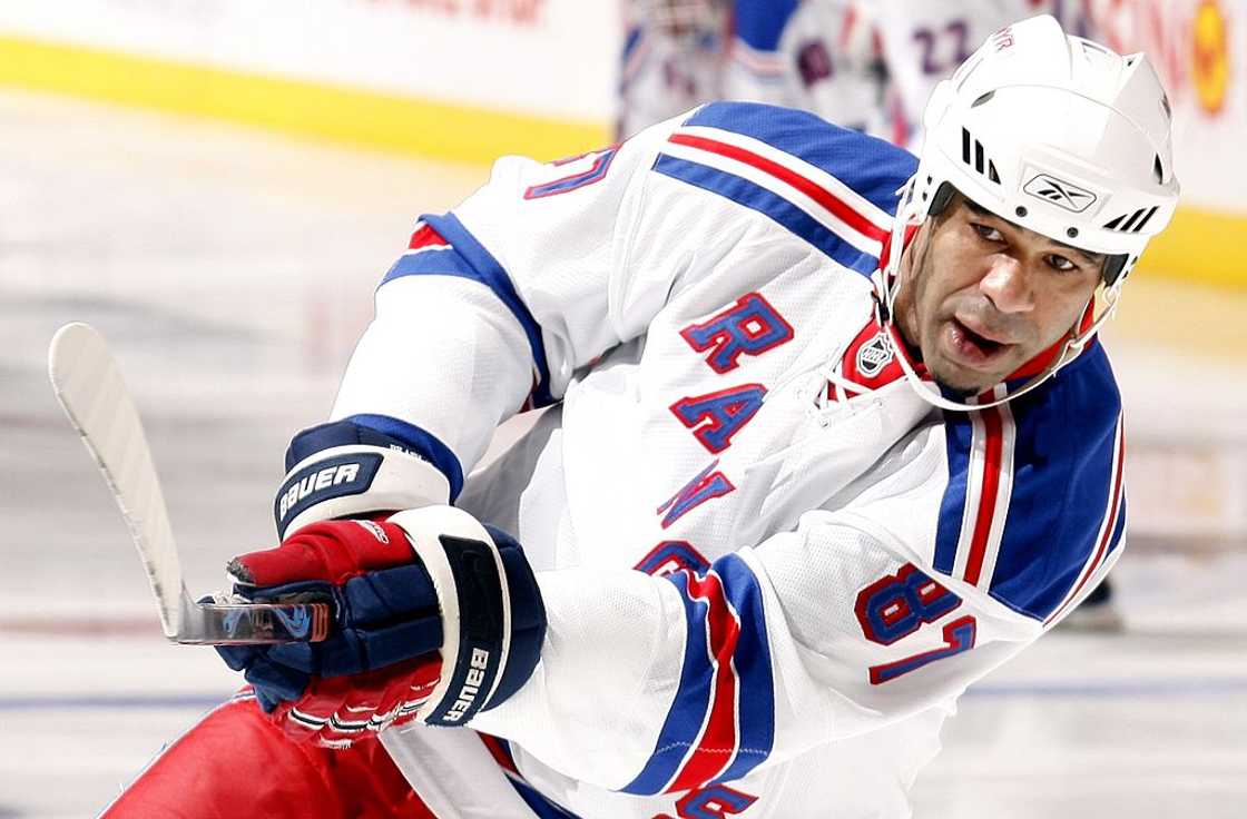 Donald Brashear shoots during warmup before a NHL game against the Toronto Maple Leafs