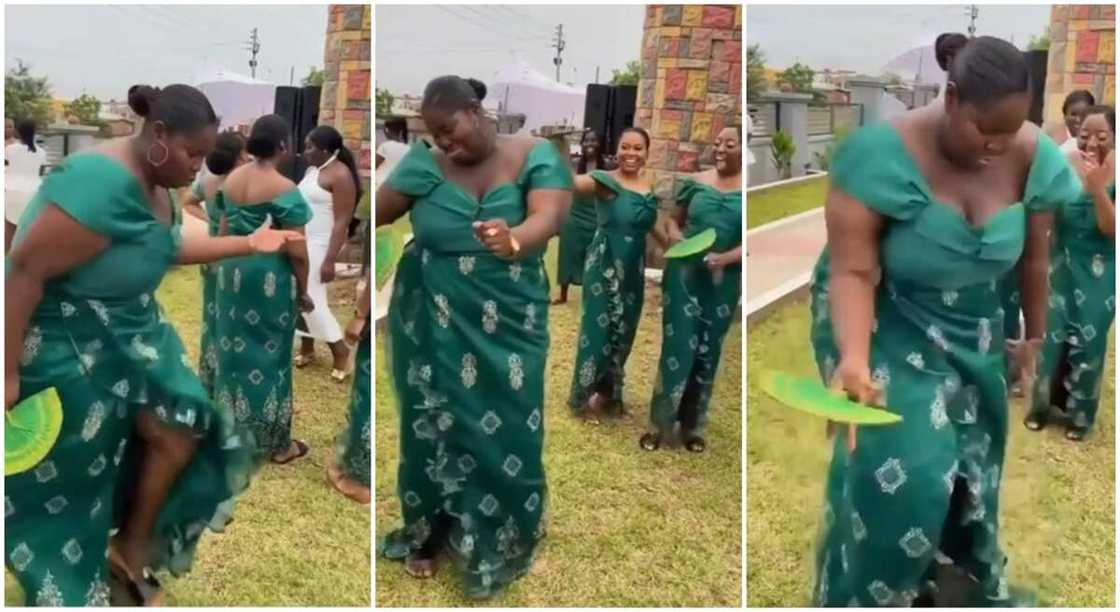 Lady in green gown showcasing nice dance steps in public surrounded by other ladies. Lady in green gown showcasing nice dance steps in public surrounded by other ladies.