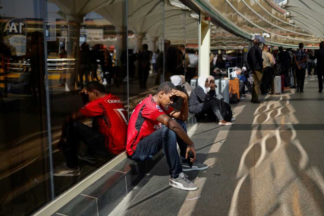 Long queues of passengers were waiting outside the airport