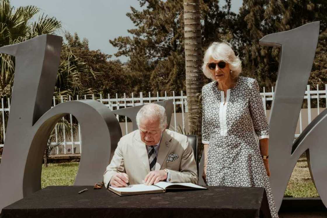 Britain's Prince Charles, accompanied by his wife Camilla, signed a note of remembrance at the Kigali Genocide Memorial Britain's Prince Charles, accompanied by his wife Camilla, signed a note of remembrance at the Kigali Genocide Memorial