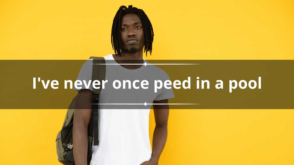A young man in a plain white tee and a backpack against a yellow background