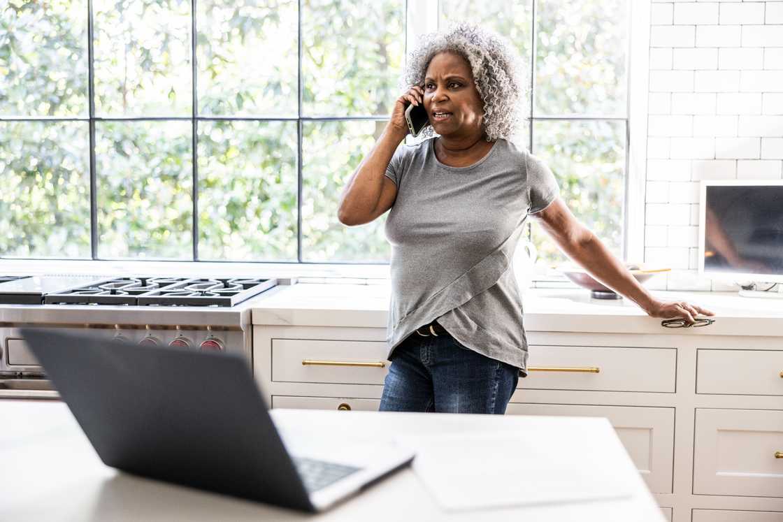 A senior woman is talking on a smartphone