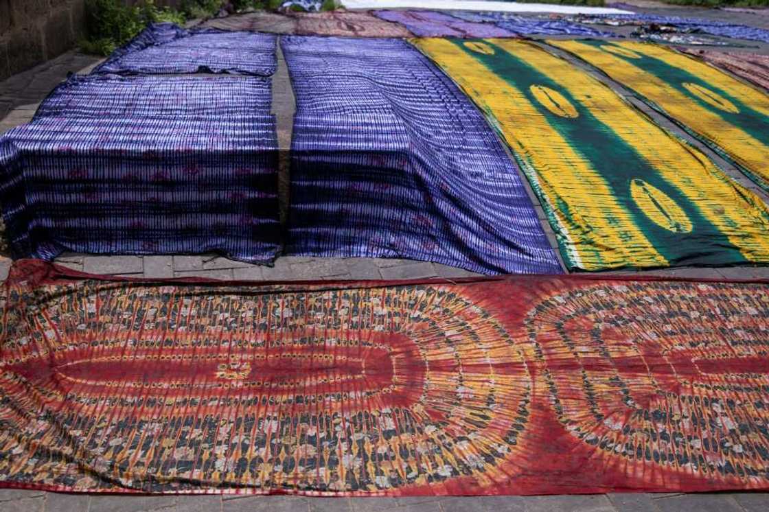 The traditional cloth faces competition from cheaper imports from China The traditional cloth faces competition from cheaper imports from China