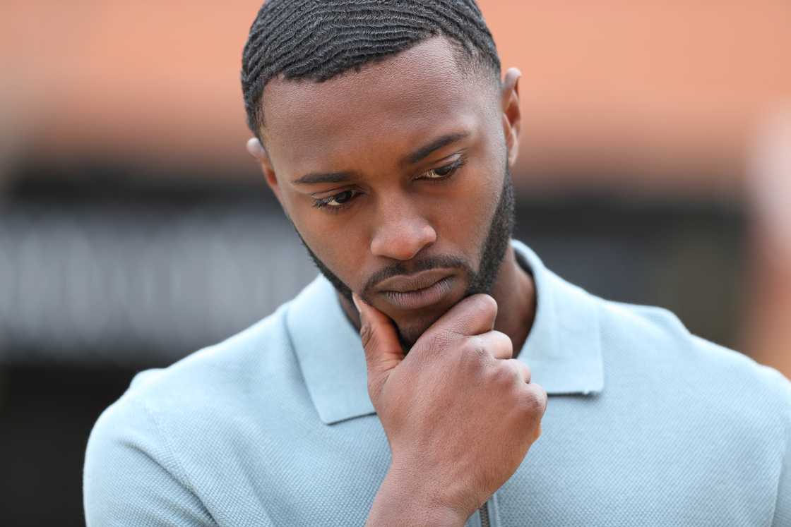 A man thinking in the street