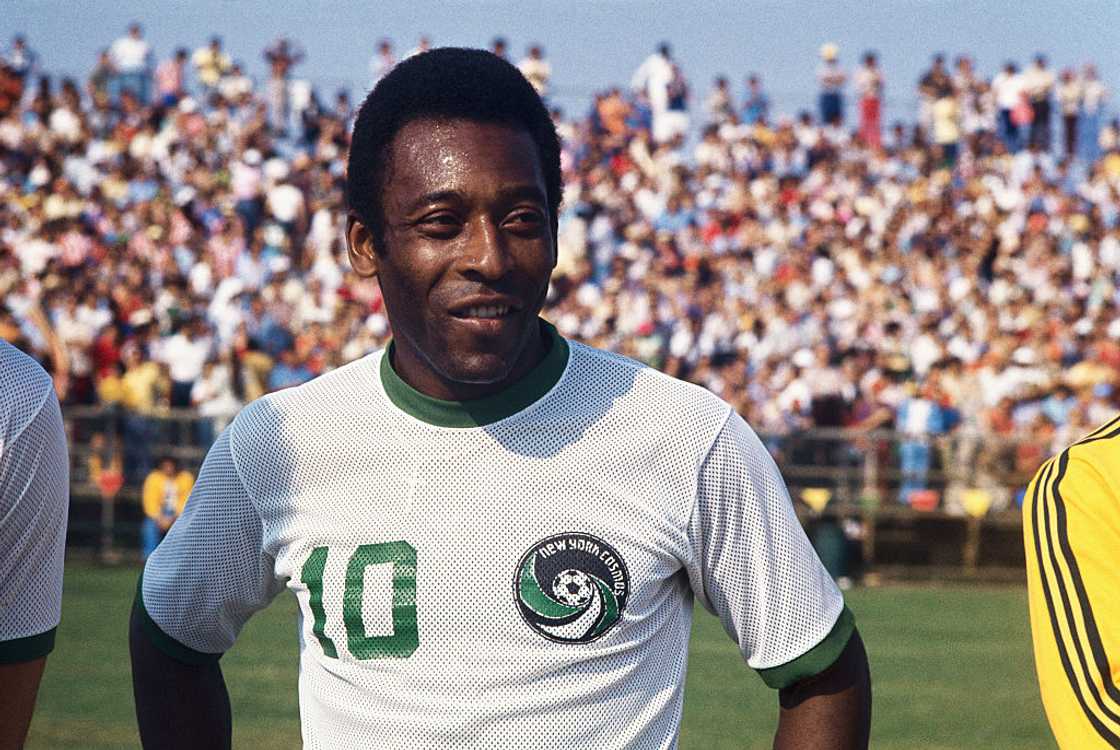 Pelé standing on the field in a New York Cosmos uniform