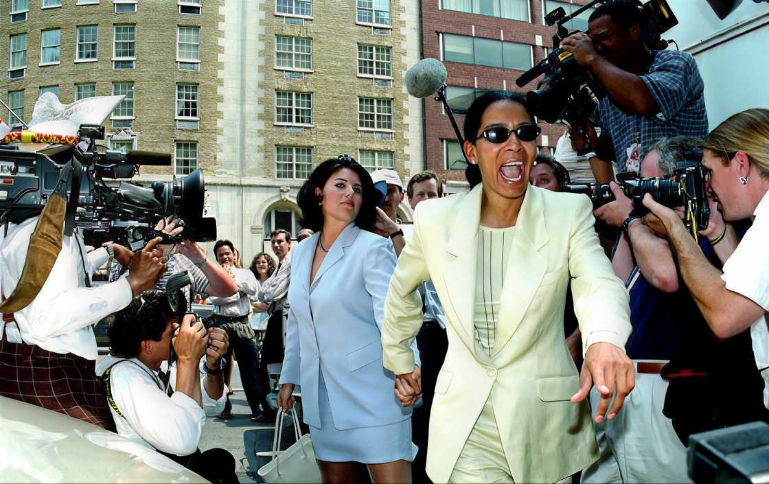 Judy Smith leads Monica Lewinsky through a crowd of reporters