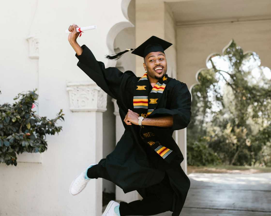 A graduate celebrating A graduate celebrating