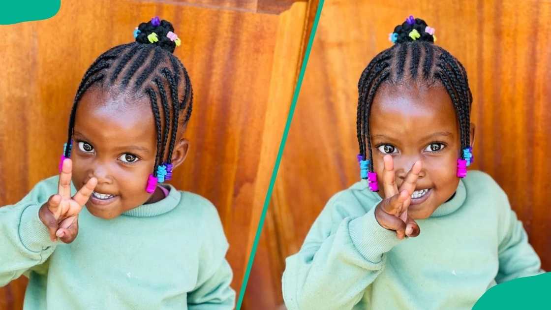 A girl wearing Updo cornrows with colored beads A girl wearing Updo cornrows with colored beads