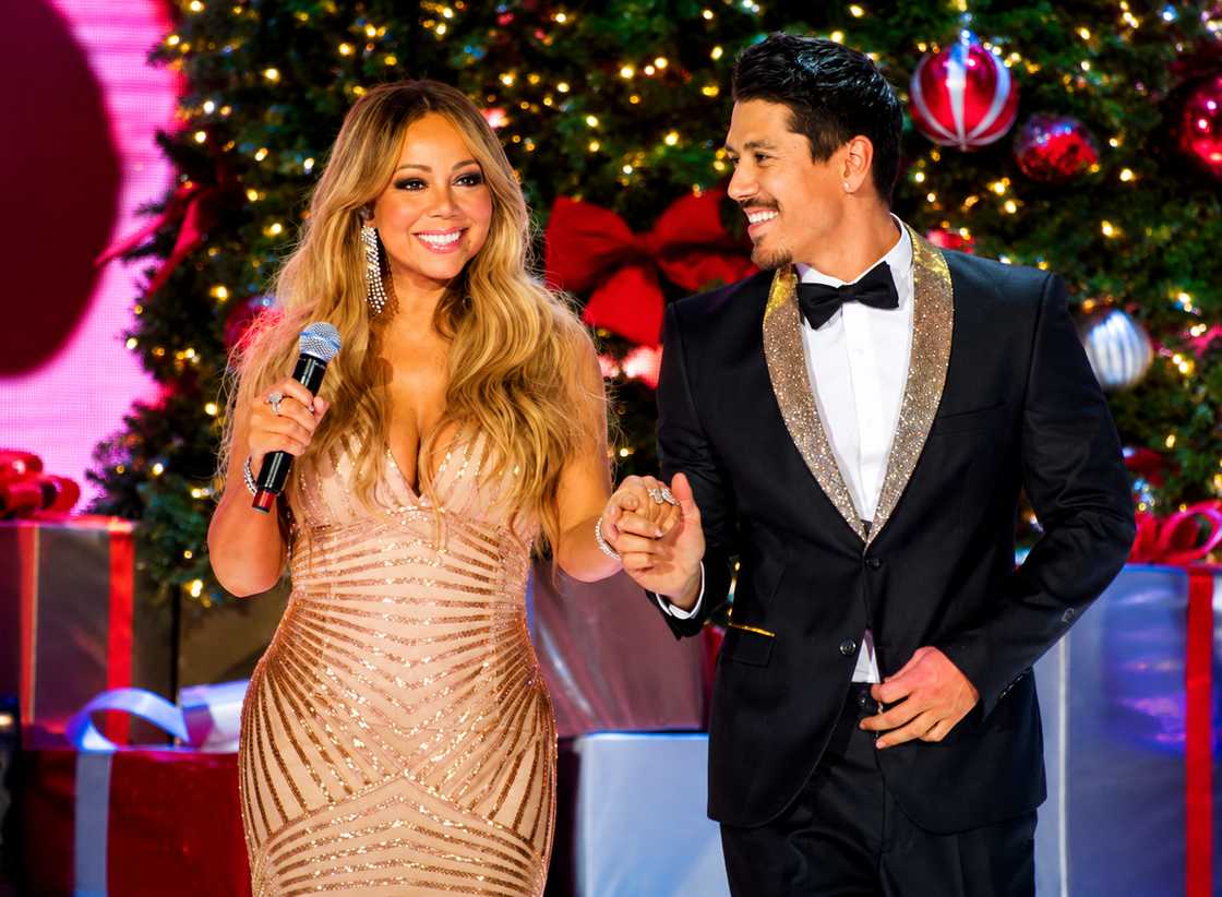 Mariah Carey and Bryan Tanaka perform on stage Mariah Carey and Bryan Tanaka perform on stage