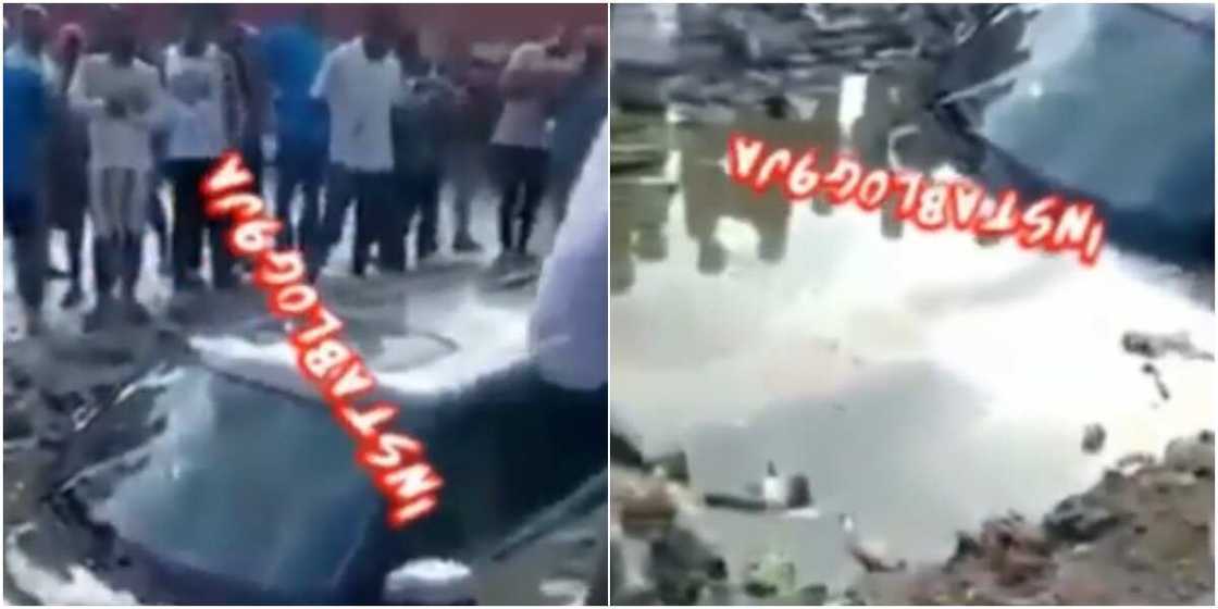 A Range Rover was submerged by floodwater in a gutter A Range Rover was submerged by floodwater in a gutter